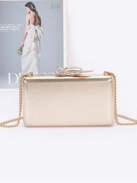 Metal Ribbon Top Clutch