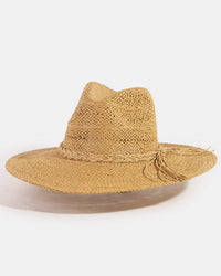 Beige straw hat with a wide brim on a white background