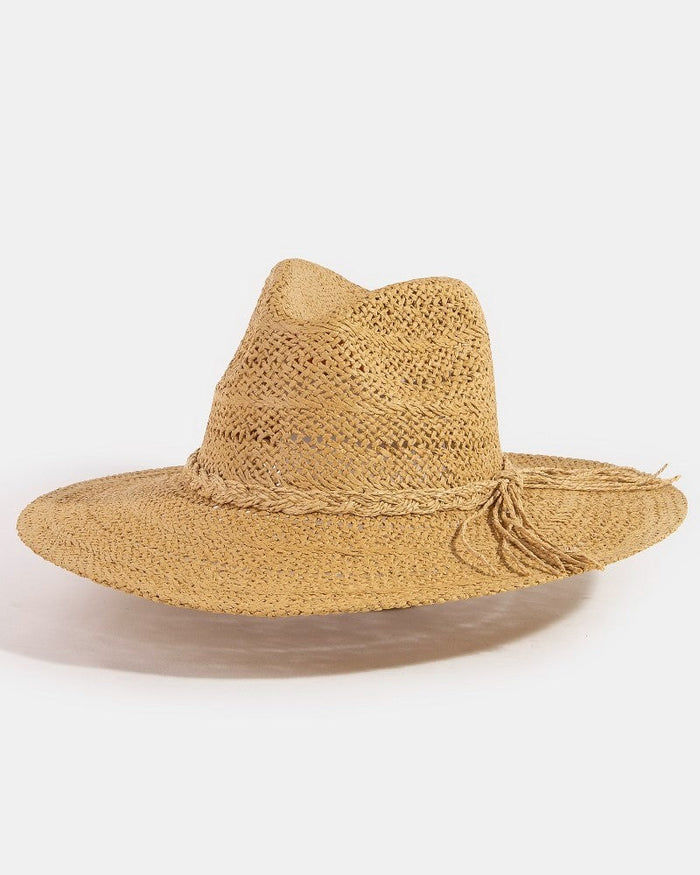 Beige straw hat with a wide brim on a white background